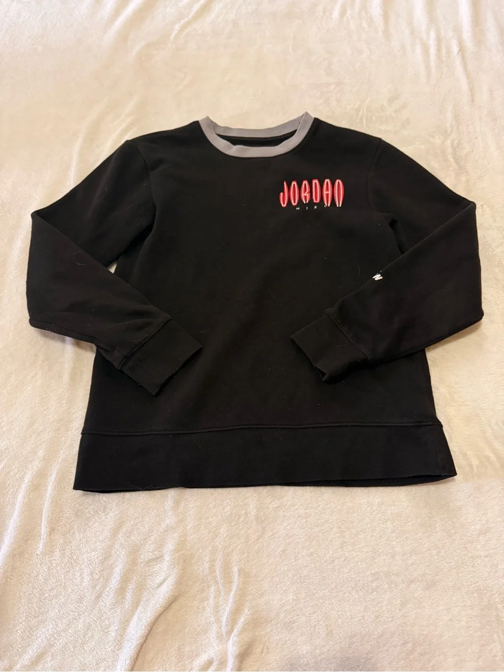 Nike Black Sweatshirt with Red Jordan Logo and Gray Neck Trim